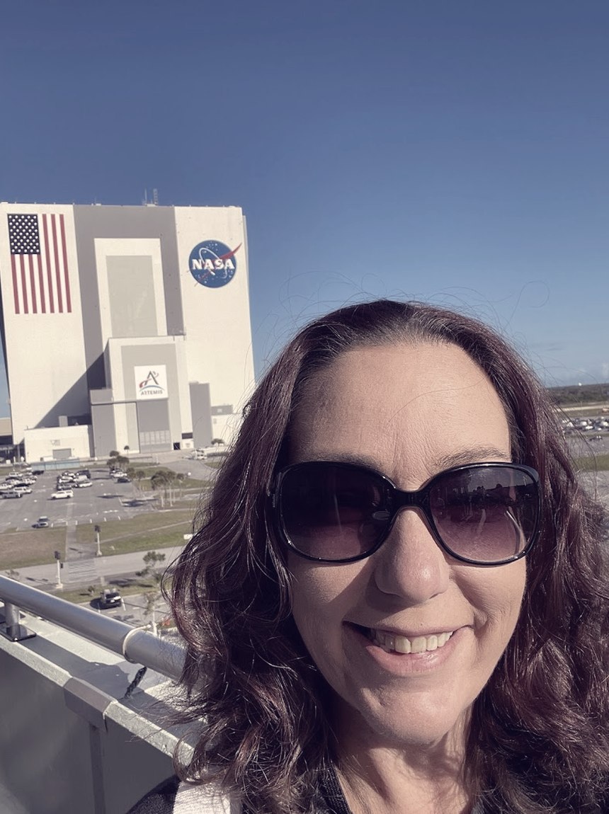 Meagan Crawford outside the Vehicle Assembly Building at Kennedy Space Center.